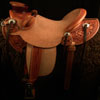 Wade tree, 15 inch seat, Gullet - 7 and 1/2 inch by 6 and 1/4 inch by 4 inch, Horn  4&1/2 inch round, 90 degree bars, 7/8ths full in-skirt riggin, Cheyenne Roll, Buckaroo outside leathers, half-breed Wade Saddle built and tooled with original floral and border design by Keith Valley.